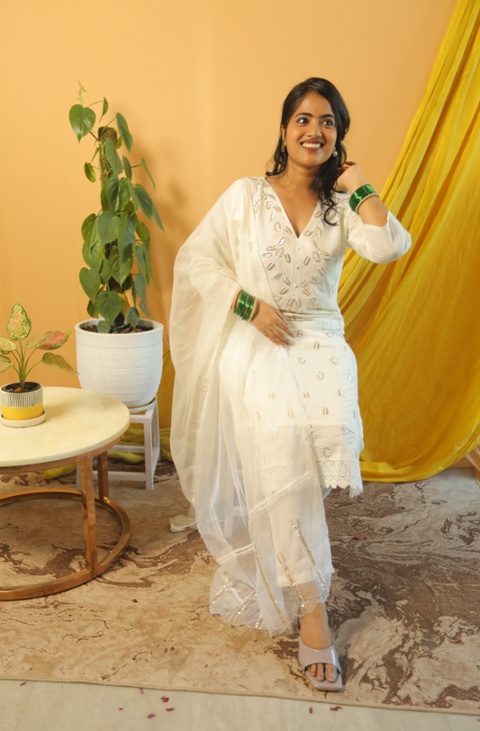 Chandini  White Suit Set with Intricate Cut Dana Embroidery