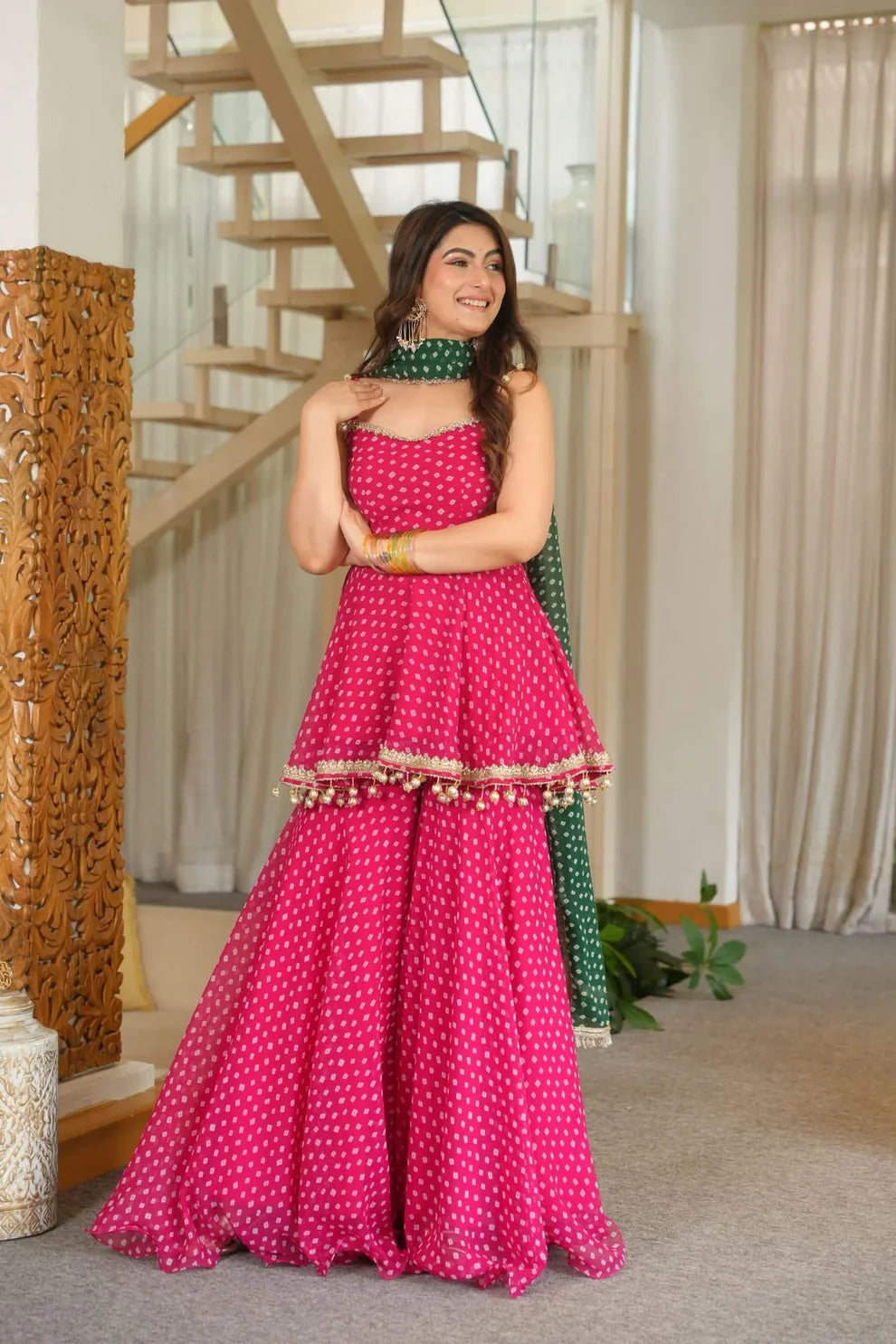 Pink Bandhini print sharara set with green dupatta with extra sleeves fabric